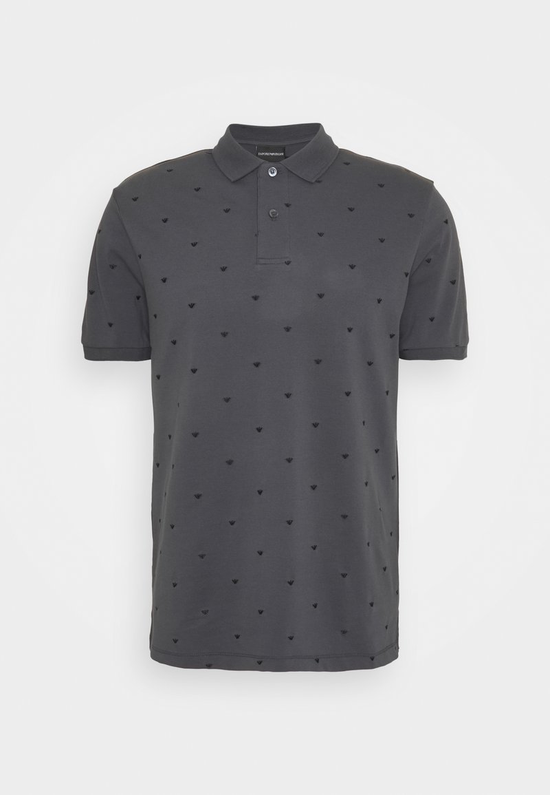 Polo gris foncé en coton, doté d'un col, de manches courtes, et d'un motif discret en relief composé de petites formes sur l'ensemble.