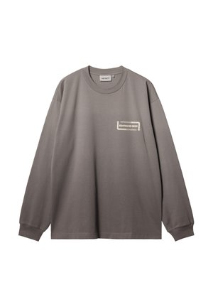 Szara koszulka z długim rękawem typu crewneck z ściągaczami, małe białe logo "Carhartt WIP" na lewej piersi oraz metka rozmiaru wewnątrz kołnierza.