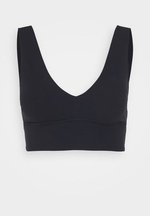 Sort bralette med dyb V-udskæring, brede skulderstropper og glat overflade. Har en syet bundbånd for støtte.