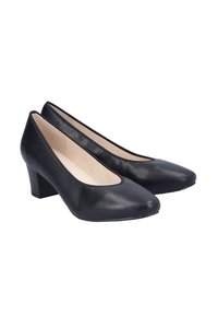Scarpe nere in pelle con tacco, punta affusolata, tacco basso e una superficie liscia. L'interno è di colore beige e presenta una soletta imbottita.