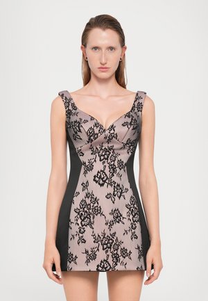 Black lace pattern on a pink fabric dress with a fitted black side design; features a deep V-neck and wide shoulder straps.