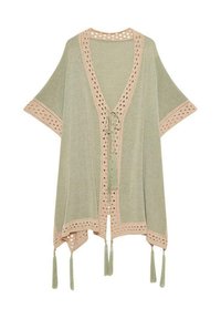 Pañuelo verde claro con detalle de tejido abierto a lo largo de los bordes, con un ribete beige y borlas en el dobladillo y las mangas. Tejido suave y texturizado.