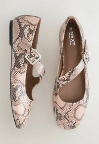 Pink snake-print flats with a cross strap and silver buckle detail. Smooth texture and rounded toe design. Suitable for various occasions.