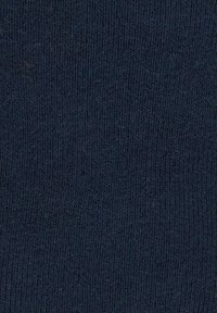 Navy blue knitted fabric with a fine ribbed texture, evenly woven and soft, showing subtle variations in color and thickness.
