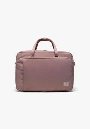 Sac à dos pour ordinateur portable en tissu rose poudré, de forme rectangulaire, avec deux poignées, poche zippée à l'avant, côtés rembourrés, étiquette de logo en bas à droite.