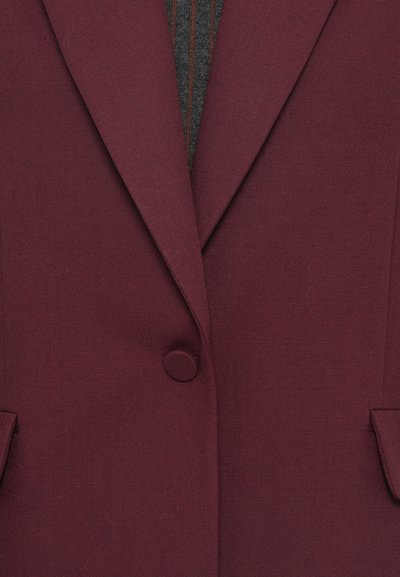 Blazer bordeaux in tessuto strutturato, con chiusura a un bottone, rever a incavo e due tasche laterali.