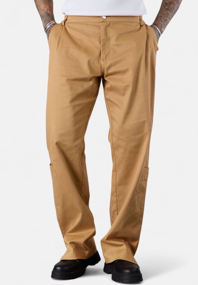 Beige, straight-leg pants made of durable fabric featuring side pockets and a button closure. Smooth texture with a classic design.