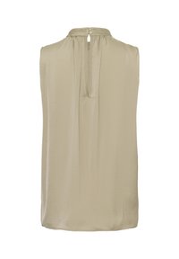 Blouse beige sans manches avec une ouverture en forme de goutte dans le dos, fermée par deux petits boutons au col.