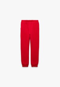Röda sweatpants i mjukt material, med elastisk midja och ribbade muddarna vid anklarna för en tät passform.