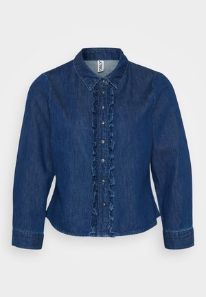 Donkerblauwe denim button-up shirt met een gerimpeld voorpand, kraag en lange mouwen. Het ontwerp bevat zilveren knopen en een getailleerde pasvorm.