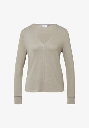 Top a maniche lunghe a V in beige chiaro, realizzato in tessuto testurizzato. Presenta una sottile cucitura centrale e polsini aderenti. Design semplice e pulito.