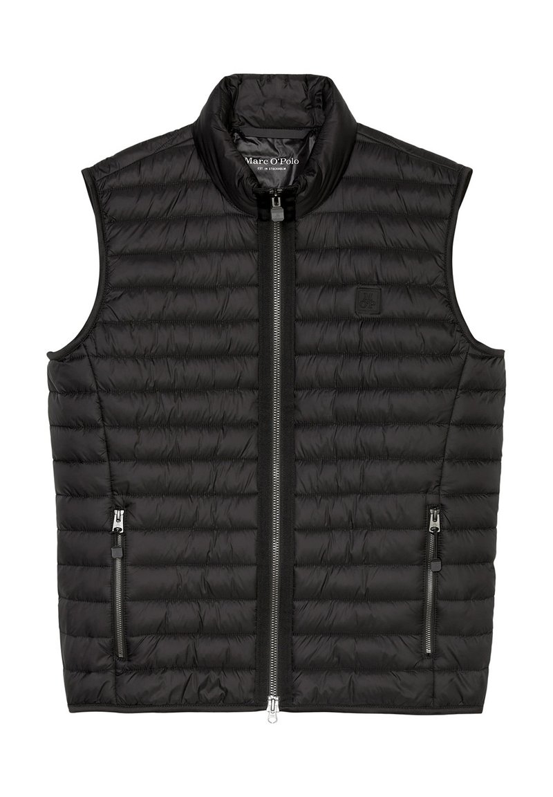 Gilet rembourré noir avec col montant, texture matelassée, zips sur le devant et deux poches latérales zippées. Étiquette de marque visible à l'intérieur.