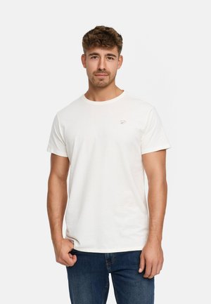 White cotton t-shirt with a crew neck and short sleeves, featuring a small graphic on the left chest. Worn with blue jeans.