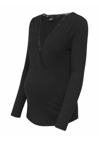 Musthave pikkade varrukatega rasedustop, millel on sooniktekstuur, V-kaeluse pitsäär, külgselt istuv kehaosa ja piisavalt ruumi kasvavale kõhule.