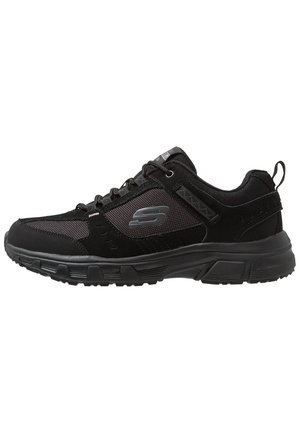 Black athletic shoes featuring a mix of suede and mesh materials, lace-up closure, padded collar, and textured rubber outsole for grip.