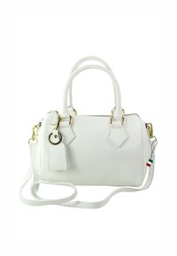 Small white leather handbag with textured finish, gold hardware, dual handles, detachable strap, and geometric tag accents.