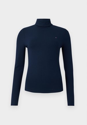 Donkerblauw geribbelde coltrui met lange mouwen, voorzien van een klein logo op de borst. Gemaakt van rekbaar materiaal voor een aansluitende look.