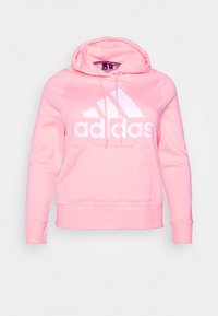 Felpa con cappuccio rosa realizzata in tessuto morbido, dotata di tasca frontale, lacci e un logo Adidas bianco con design a tre strisce.