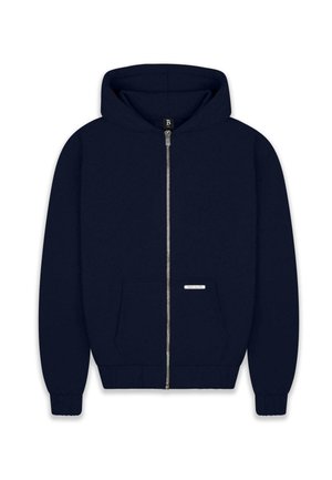 Mornarica zip-up dukserica s velikom kapuljačom, prednjim džepom, rebrastim rukavima i rubom te malim oznakom sprijeda. Mekani materijal.