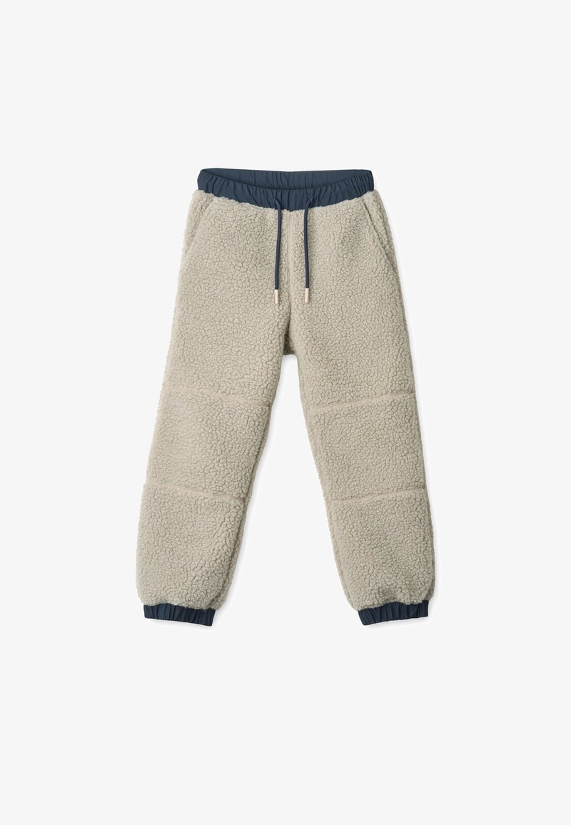 Világos bézs színű, puha tapintású polárnadrág, sötétkék elasztikus derékpánttal és állítható húzózsinórral.