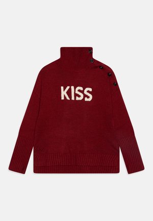 Red knit turtleneck sweater with ribbed cuffs, black buttons on the shoulder, and the word "KISS" in white letters on the front.