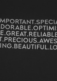 Black t-shirt with white text displaying various positive adjectives, arranged in a list. Cotton material, short sleeves, crew neckline.