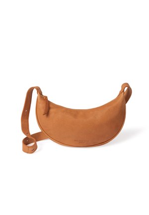Tan leather crossbody bag, curved shape, zipper closure, adjustable strap, embossed brand name on the front, smooth texture with subtle grain.