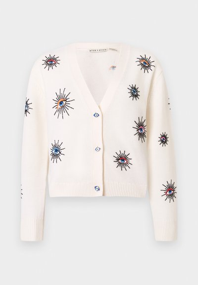 Λευκή πλεκτή ζακέτα με πολύχρωμα κεντήματα από ήλιο και μάτι, σχέδιο με V λαιμόκοψη και μπλε κουμπιά. Κοντό μήκος.