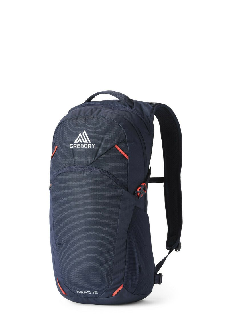 Marineblauer Rucksack mit strukturierter Oberfläche, roten Akzenten und dem "Gregory"-Logo. Verfügt über gepolsterte Schultergurte und mehrere Fächer.