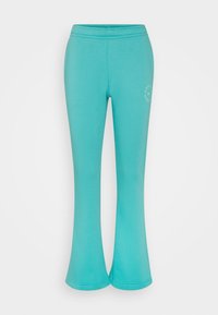 Turquoise flared leggings made of stretch fabric, featuring a smooth texture and a subtle logo detail near the waistband.
