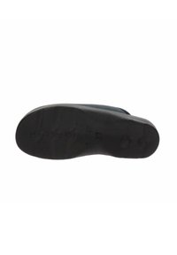Suola di scarpa in gomma nera con superficie texture e un motivo di battistrada identificabile. Leggera curvatura al tallone, parte anteriore piatta, indicazione della misura visibile.