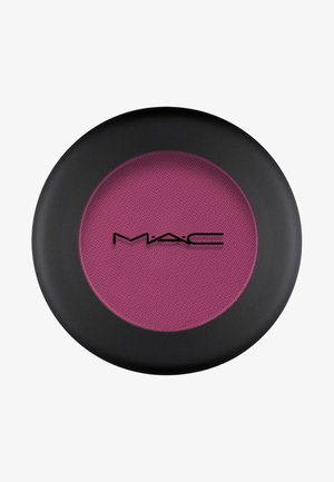 MAC Lidschatten in einer runden, mattschwarzen Verpackung. Enthält ein lebendiges, strukturiertes lila Puderinnere. Markenlogo zentriert in Schwarz.