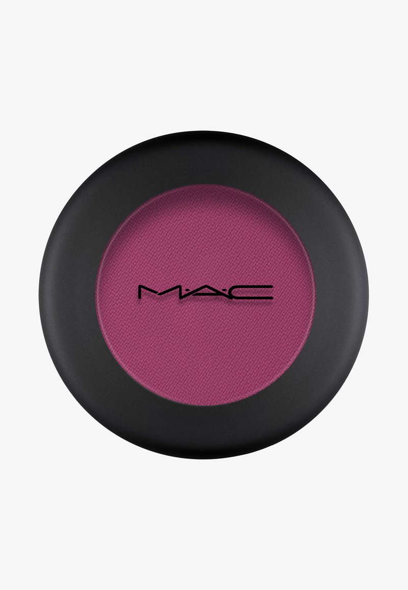 MAC Lidschatten in einer runden, mattschwarzen Verpackung. Enthält ein lebendiges, strukturiertes lila Puderinnere. Markenlogo zentriert in Schwarz.