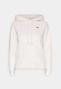 Un hoodie rose clair en coton doux. Il dispose d'une poche avant, d'une capuche avec cordon de serrage et d'un petit logo rouge sur la poitrine. Poignets côtelés.