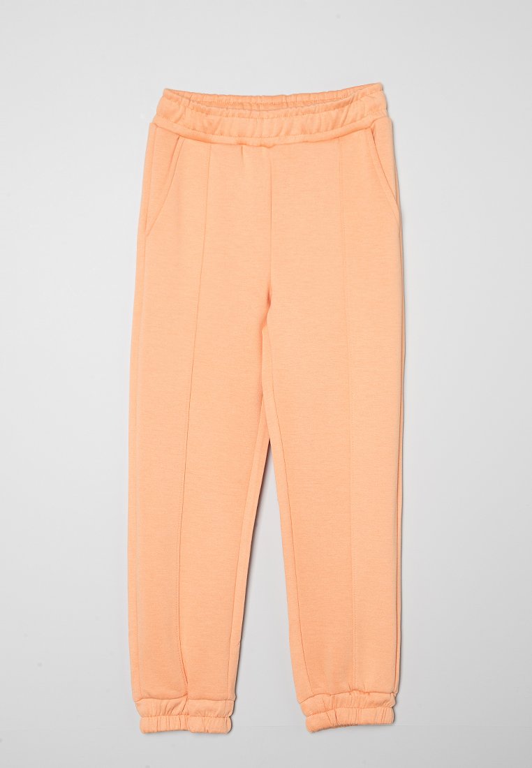 name it Trainingsbroek abrikoos