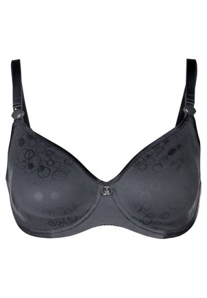 Sutiã preto com tecido semi-transparente, padrão circular subtil, alças ajustáveis e um detalhe decorativo ao centro. Textura suave.
