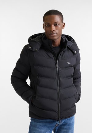 Black puffer jacket with a zip closure and hood. Features a quilted design, two front pockets, and a small logo on the chest.