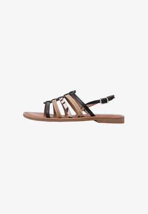 Sandales à lanières avec une tige en textile noire et beige, ornées d'accents métalliques. Semelle plate, bride de cheville ajustable et design à bout ouvert.