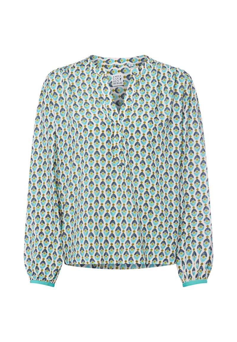 Blouse à manches longues en tissu léger, avec un fond blanc orné d'un motif de plumes de paon en turquoise, bleu et jaune, patte de boutonnage, manches élastiques.