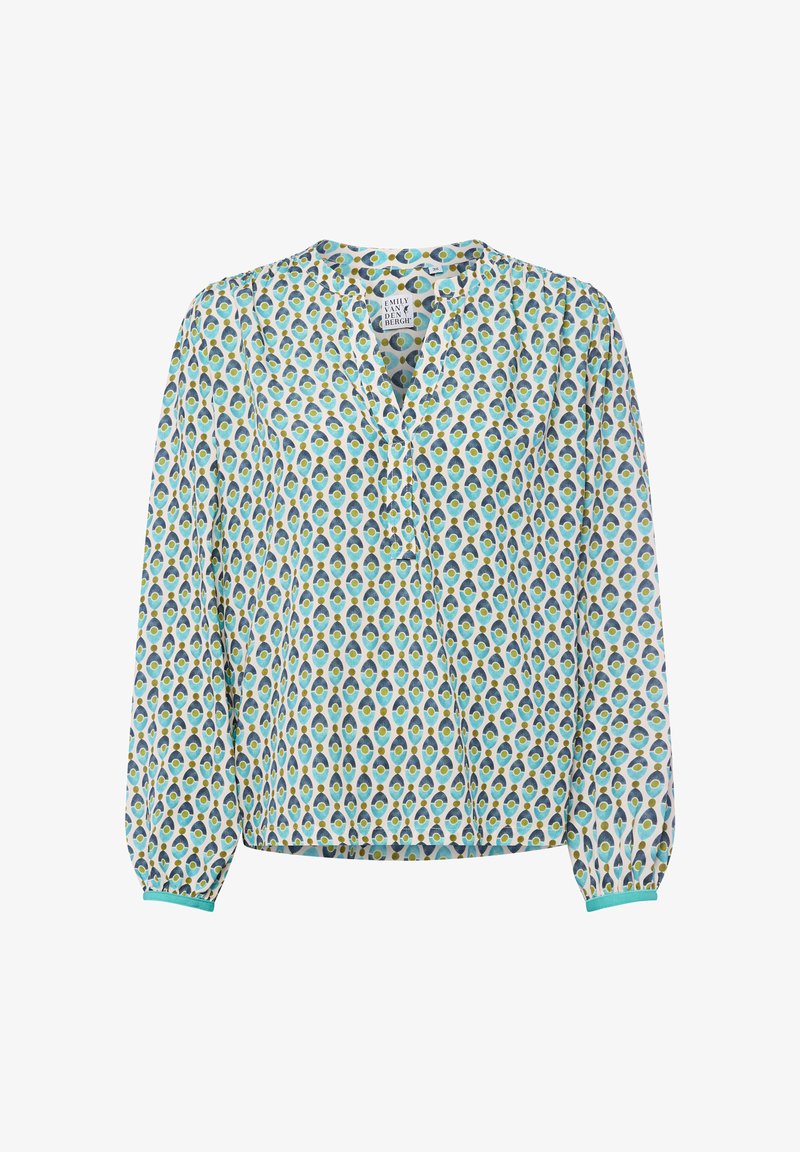 Blouse à manches longues en tissu léger, avec un fond blanc orné d'un motif de plumes de paon en turquoise, bleu et jaune, patte de boutonnage, manches élastiques.