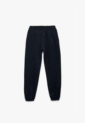 Chándal azul marino con cintura elástica y puños ajustados; hecho de una tela suave, con una textura lisa y sin patrones.