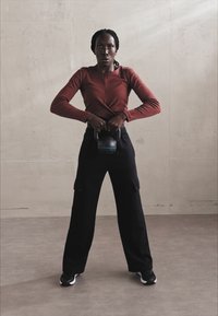 Champion EMOTIONAL DANCE WIDE LEG CARGO PANTS - Treniņtērpa apakšdaļas - black