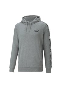 Sudadera con capucha gris hecha de tela suave, con capucha, bolsillo canguro y rayas laterales negras con detalles de logo. Corte clásico con puños acanalados.