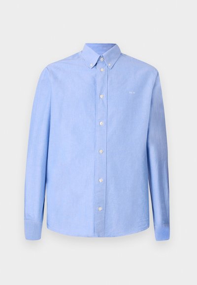 Vaaleansininen pitkähihaine paita, joka on valmistettu sileäksi tuntuvasta kankaasta. Yksiommellinen kaulus ja valkoiset napit. Pienikokoinen logo rinnassa.