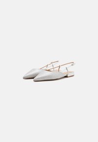 Silver slingback shoes with a pointed toe, textured surface, and a flat heel. Features adjustable straps and a simple, elegant design.