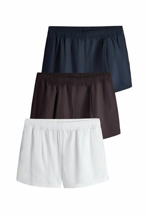 Drei Paare schlichte Shorts in Marineblau, Schwarz und Weiß mit elastischem Bund, vertikal auf weißem Hintergrund gestapelt.