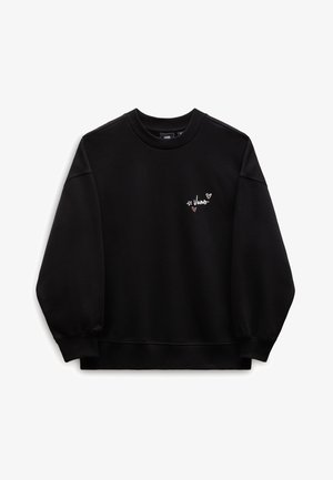 Sweat-shirt noir à col rond avec petit logo Vans blanc et deux petits dessins de cœurs roses sur le côté gauche de la poitrine, manches longues, poignets et ourlet côtelés.