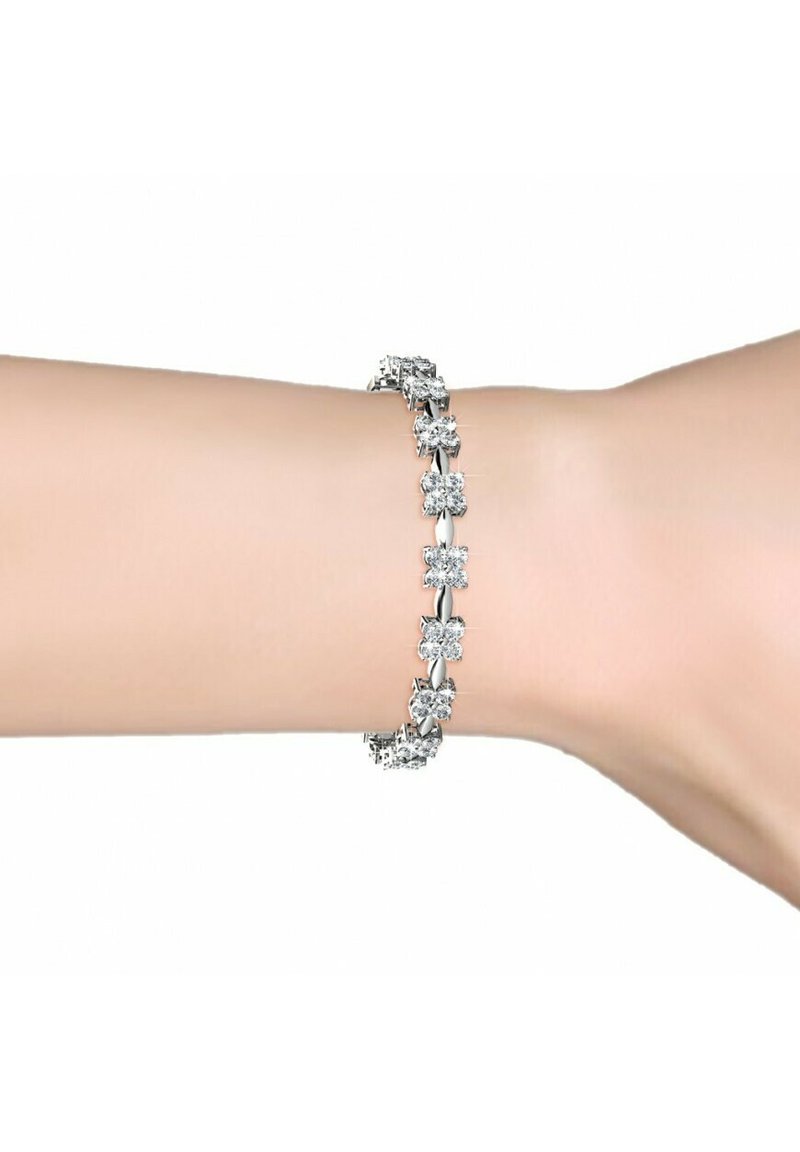 Zilveren armband met afwisselend bloemvormige schakels en heldere, ronde rhinestones. Gladde textuur, verstelbare pasvorm en glanzende afwerking.