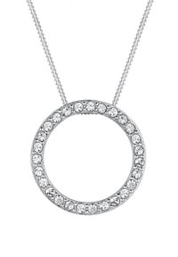 Sølv vedhængs halskæde med et rundt design, omkranset af små klare krystaller. Fastgjort til en delikat kæde.