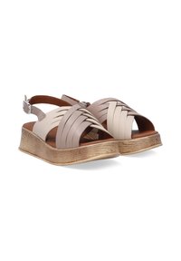 Beige leather sandals with woven design, open toe, adjustable ankle strap, and a textured brown platform sole.